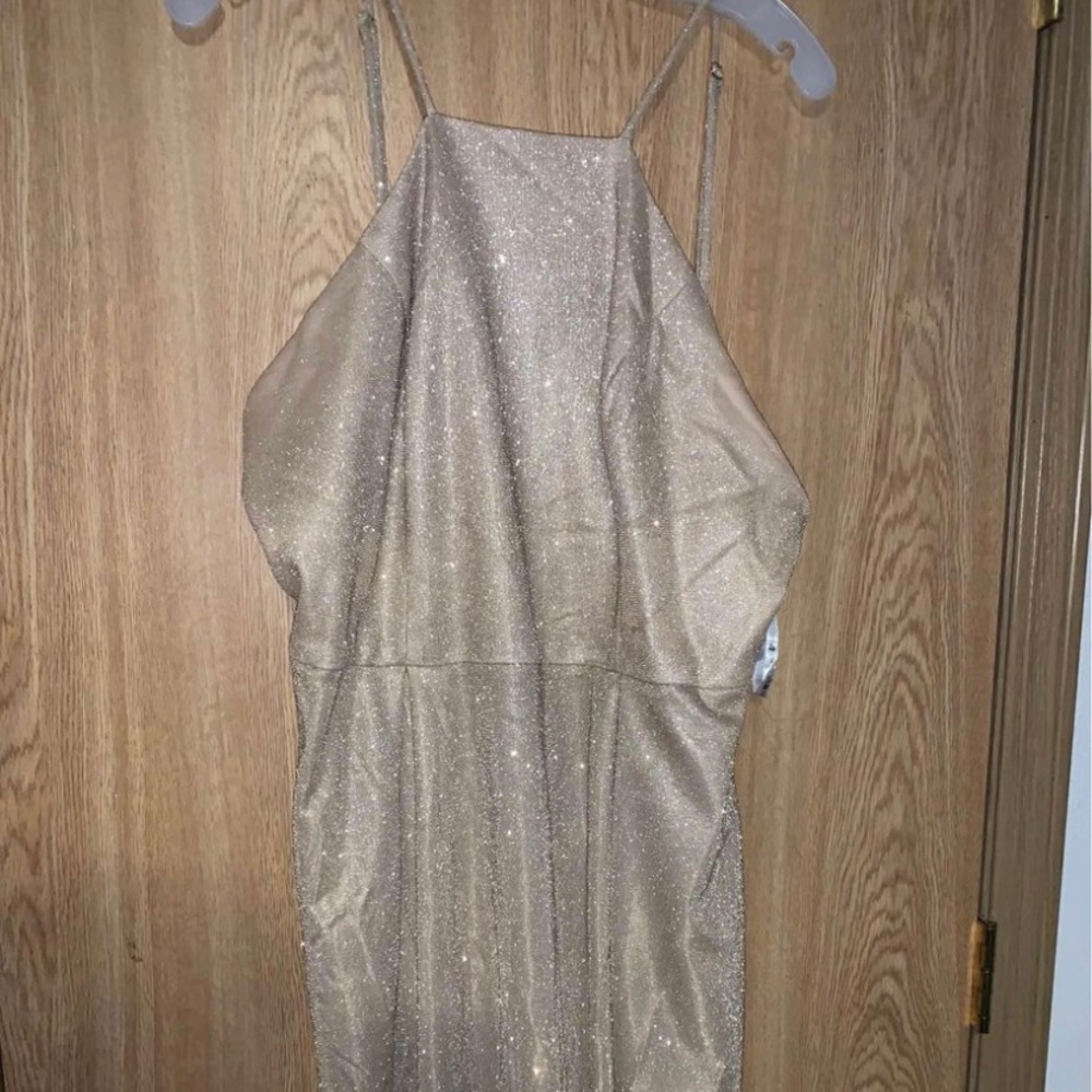 This is a David’s Bridal dress. Size 18 and about knee length